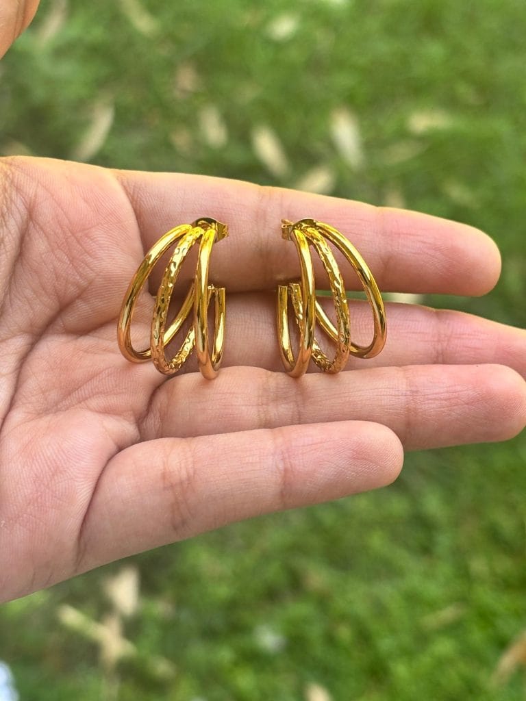 lightweight daily wear studs online gold plated minimal earrings India affordable pearl studs under 1000 crystal floral earrings for gifting black drop earrings with pearls spiral gold studs minimalist design tarnish resistant golden hoops guardian angel wing pendant gold champagne pearl earrings online India orbit design double hoop earrings