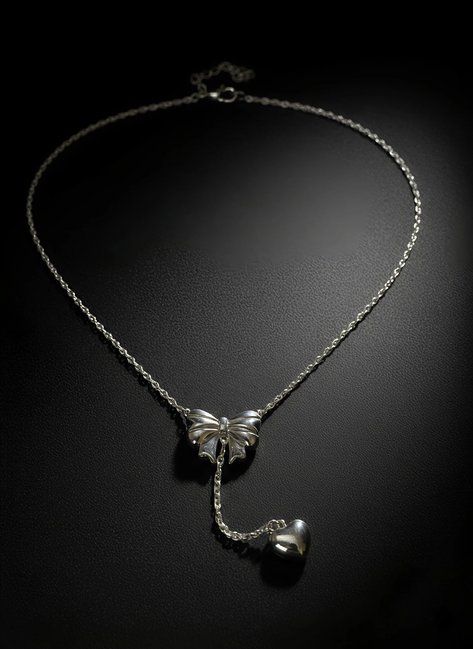 Add a touch of romance with this dainty bow and heart necklace. Featuring a delicate ribbon charm and a polished heart pendant, it’s the perfect minimalist gift for her — ideal for everyday wear, anniversaries, or Valentine’s Day. ROSAEL