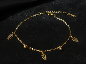 Celebrate nature’s elegance with this delicate gold chain adorned with intricate leaf charms and shimmering beads. Wear it as a dainty bracelet or a minimalist anklet for a subtle, botanical touch. Perfect for nature lovers, it’s a timeless piece that adds understated beauty to any look. ROSAEL